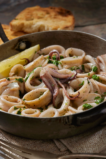 Lemon Pepper Grilled Calamari with Garlic, Butter, Fresh Parsley and Toasted Bread