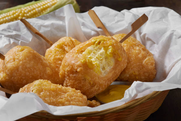 Beer Battered Corn on the Corn Beer Battered Corn on the Corn with Spicy Mustard Dip corn cob eaten stock pictures, royalty-free photos & images