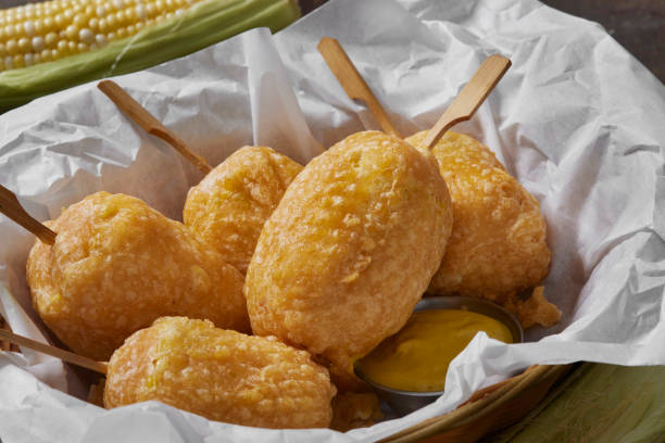 Beer Battered Corn on the Corn Beer Battered Corn on the Corn with Spicy Mustard Dip corn cob eaten stock pictures, royalty-free photos & images