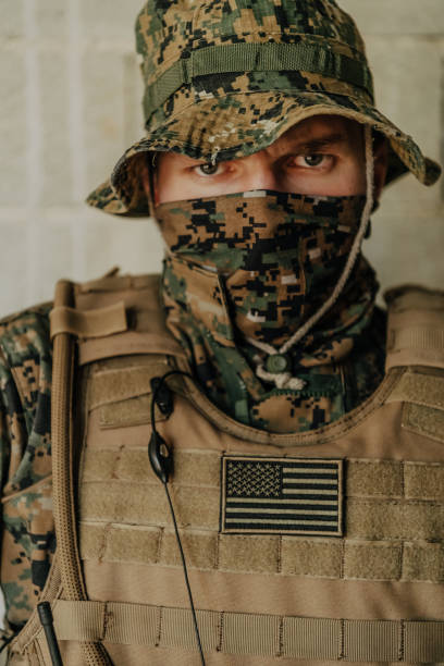 istock American marine corps special operations soldier preparing tactical and commpunication gear for action battle closeup 1477266559