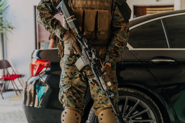 istock American marine corps special operations soldier preparing tactical and commpunication gear for action battle closeup 1477267212