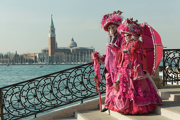Couple of masks on bridge at carnival in Venice (XXXL) stock photo