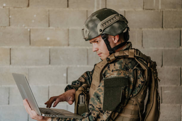 istock American soldier in military uniform using laptop computer for drone controlling and to stay in contact with friends and family 1477270910