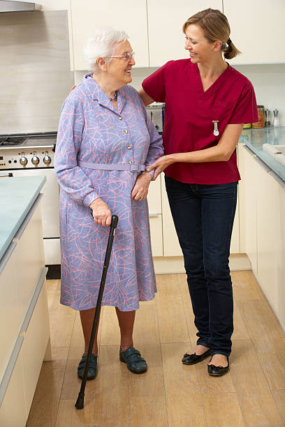 istock Senior woman and carer in kitchen 147727174