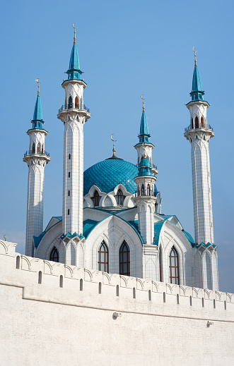 Kul Sharif Mosque (Qol Sharif Mosque) and old fortified wall of the Kazan Kremlin on a sunny day at blue sky. The landmark in downtown Kazan city, Republic of Tatarstan, UNESCO site.