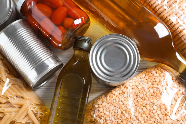 istock Different products on white wooden table, flat lay. Food donation 1477275392