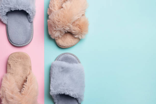 istock Different soft slippers on color background, flat lay. Space for text 1477277077