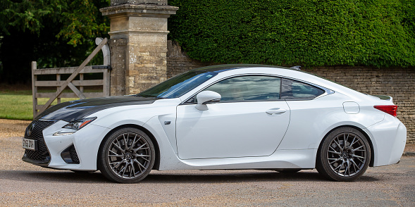 Turvey, Bedfordshire, UK - June 12th 2022. 2016 4969 cc LEXUS RCF  car driving through an English village