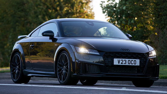 Bicester,Oxon,UK - Oct 9th 2022. 2021 black Audi TT car driving on an English country road
