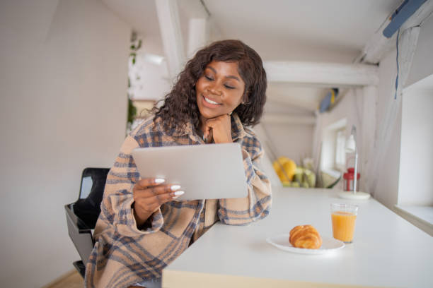 istock Happy young woman digital tablet 1477284645
