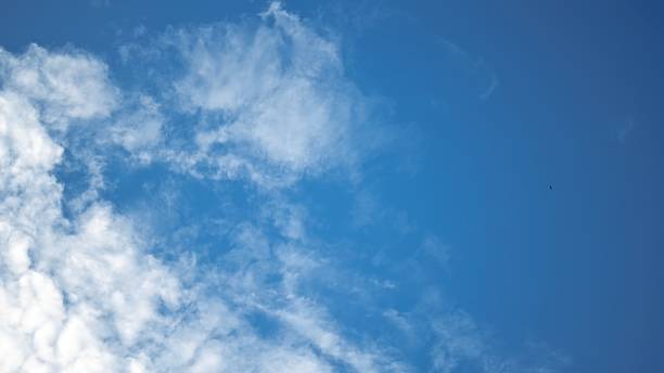 istock background of beautiful blue sky with white clouds during the day, spring 1477287943