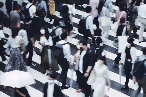 People crossing the pedestrian crossing Business image