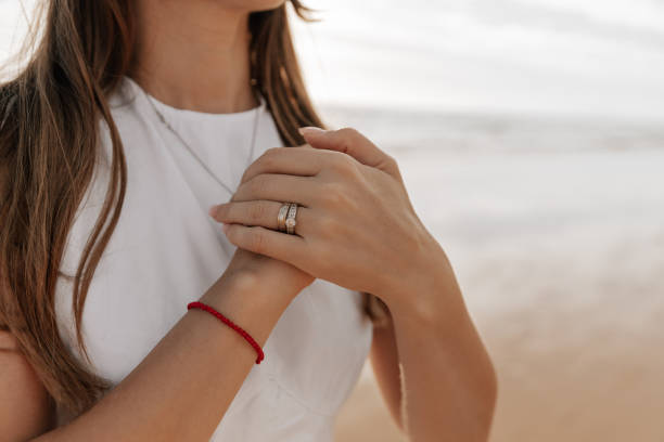 Worried mother clasping hands on chest