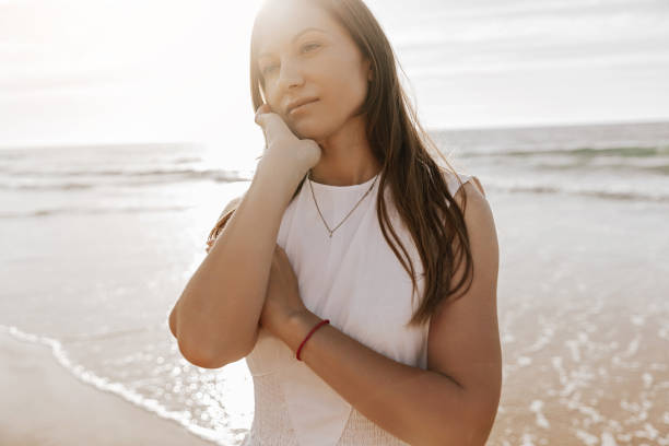 istock Thoughtful woman resting near sea 1477291742