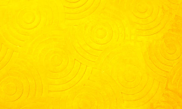 istock Yellow concrete texture wall background. Abstract orange paint floor stamped concrete surface clean polished on walkway in garden. Wallpaper pattern curved circle rough orange cement stone decorative 1477294604