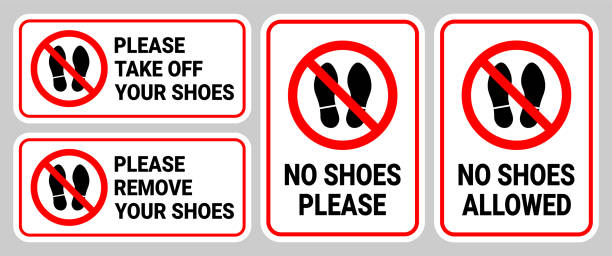 No Shoes Sign Collection Vector "No Shoes" sign collection in vector format, featuring a crossed-out shoe symbol on a variety of designs. Perfect for indicating shoe-free zones in homes, offices, or public spaces. Barefoot stock illustrations