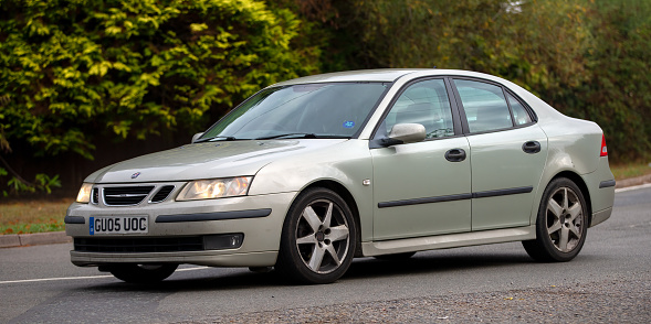 Whittlebury,Northants,UK - August 26th 2022. 2005 2000 cc silver Saab 9-3 saloon car travelling on an English country road