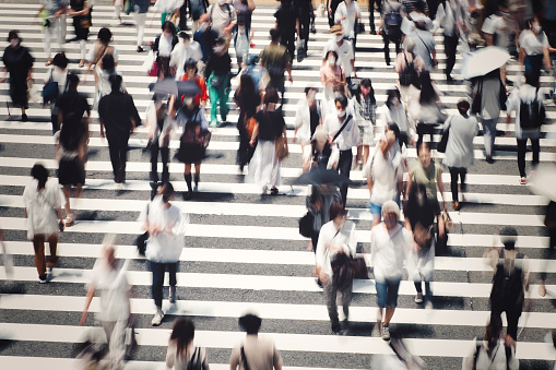 People crossing the pedestrian crossing Business image