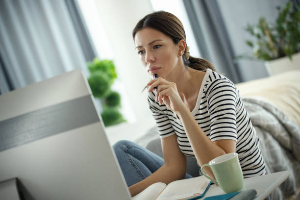 istock Young woman learning at home. 1477299010