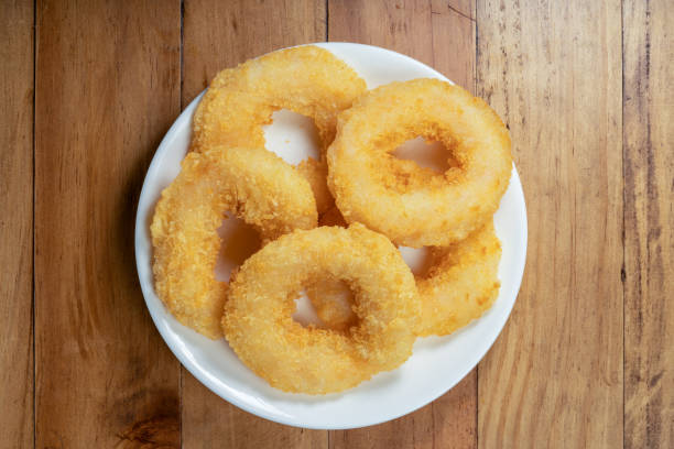istock Fried shrimp donut in white plate on wooden table. 1477309594