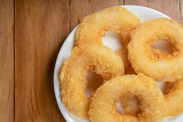 istock Fried shrimp donut in white plate on wooden table. 1477309651