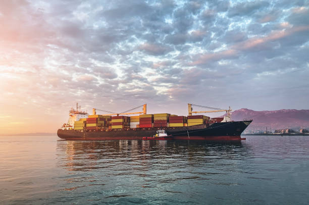 istock Cargo freight ship with containers sailing to industrial logistic port 1477310582