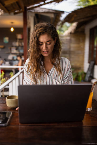 istock Woman working on laptop in cafe 1477310626