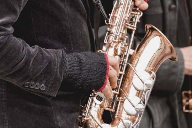 istock Midsection of a man playing a saxophone 1477314759