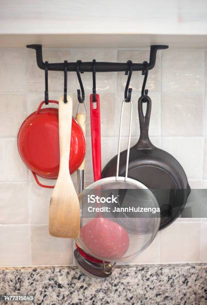 Kitchen Rack With Frying Pans Utensils Strainer Stock Photo - Download Image Now - Colander, No People, Beige