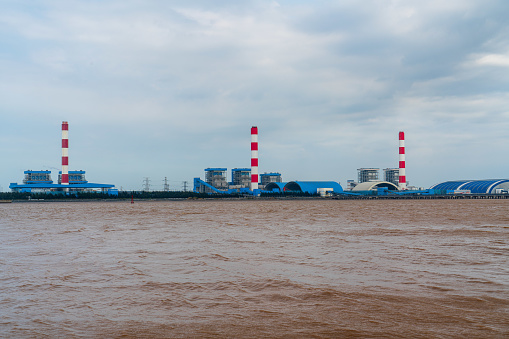 3 chimneys of thermal power plants on Tra Vinh river - Tra Vinh province, south Vietnam