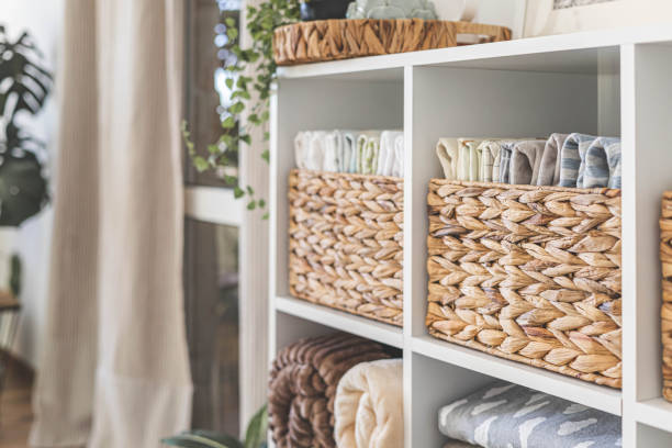 istock Neatly folded linen cupboard shelves storage at eco friendly straw basket placed closet organizer 1477320458