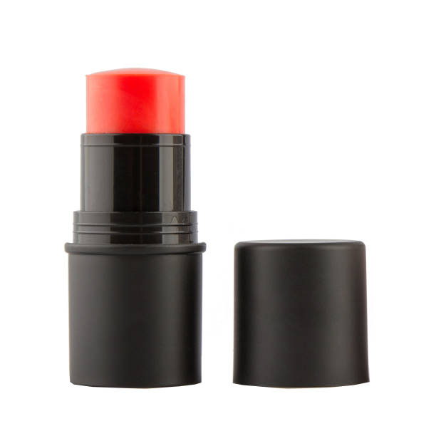 istock Cream blush in a black case on a stick on a white isolated background 1477320659