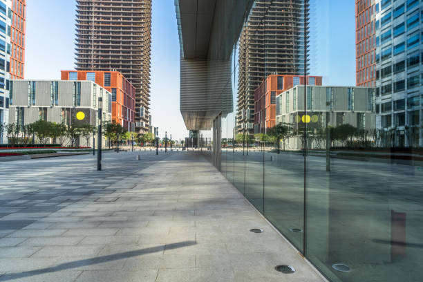 istock trees and buildings reflected on clean glass wall, china 1477321049