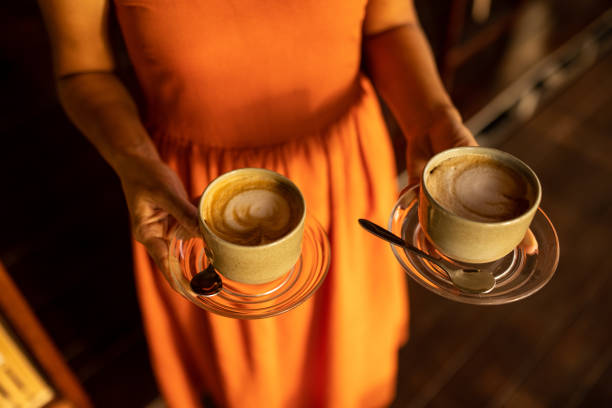 istock Female waitress carrying coffee 1477321213