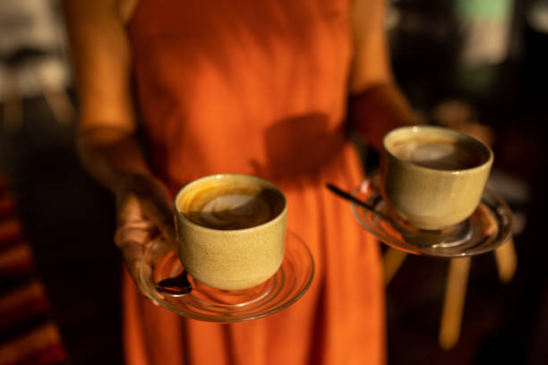 istock Female waitress carrying coffee 1477321256
