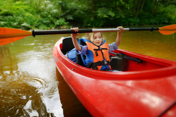 istock Cute child kayaking on a sunny summer day 1477325684