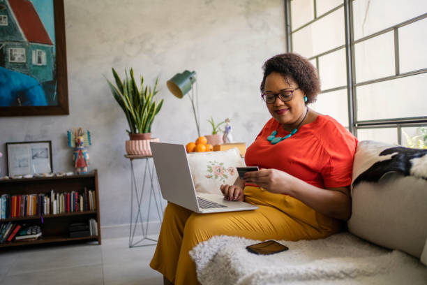 istock Black mature woman shopping online 1477327921