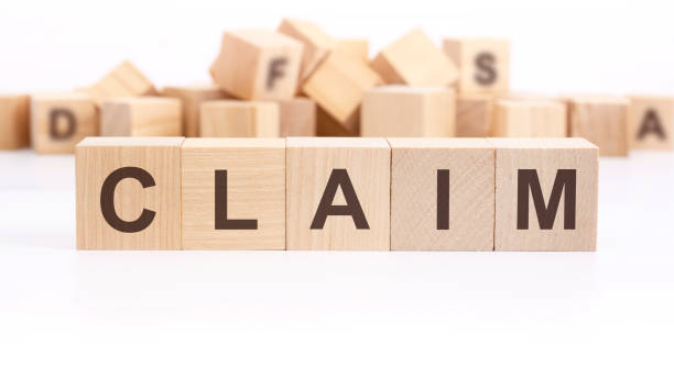 istock text CLAIM made of wooden cubes and different words on white background 1477332249