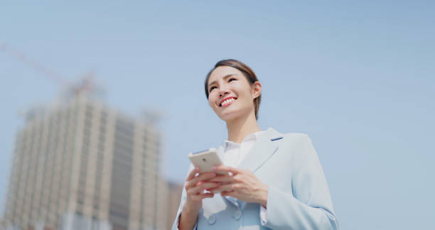 istock businessfemale use mobile phone 1477339197