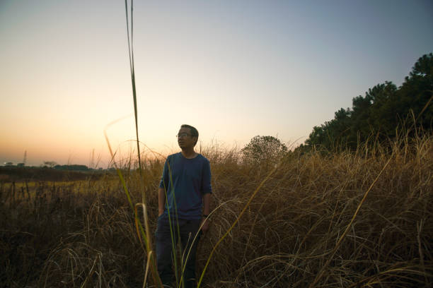 istock one man alone in the grassland near dawn 1477344834