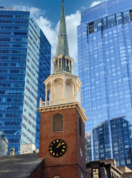 istock Bell tower with belfry latten and spire under the sun 1477346042