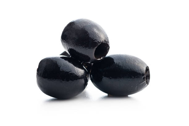 istock Pitted black olives isolated on white background. 1477366544