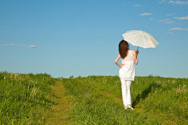 istock Beautiful girl with white umbrella 147737081