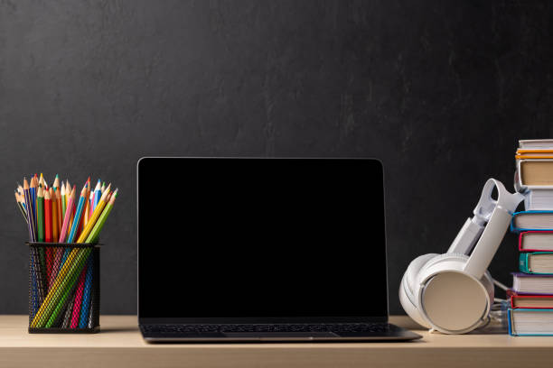 istock Laptop, books and pencils on desk 1477376600