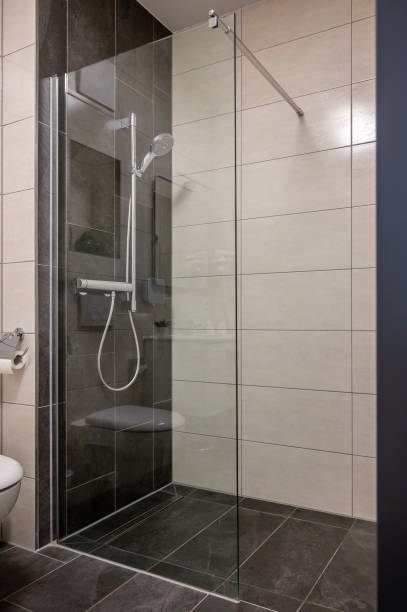 istock Modern designed bathroom with open shower and glass shower wall 1477377803