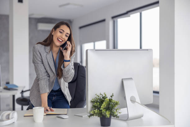 istock Female entrepreneur with computer working in modern office 1477393809