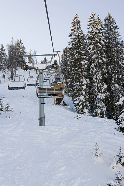 istock snowboarder in a ski lift 147739990