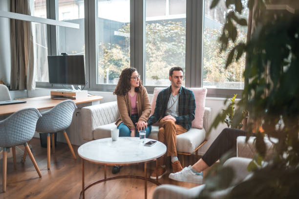 istock Casually Dressed Married Couple on Therapy Couch 1477400163