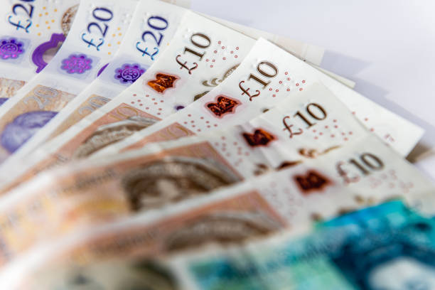 Close up of United Kingdom Pound Sterling bank notes. Close up of United Kingdom Pound Sterling bank notes. british currency stock pictures, royalty-free photos & images