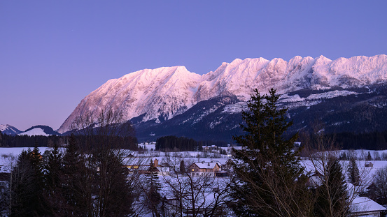 Bad Mitterndorf, Austria - February 7, 2023: Mountain Grimming on a cold sunny evening in winter, view from Bad Mitterndorf (Austria)